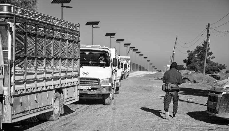 Vehicles outside the Al-Hol camp, located in northeastern Syria, now under the control of Syrian government forces. It housed numerous people suspected of having links with the jihadist group Islamic State.