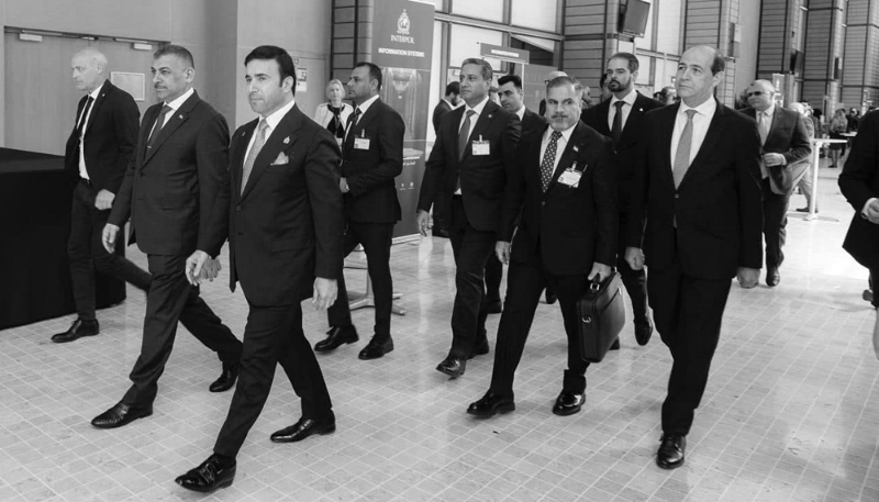 Judge Haider Hanoun (centre) with Interpol President Ahmed Naser al-Raisi (right) at Interpol headquarters in Lyon, France, in April 2024.