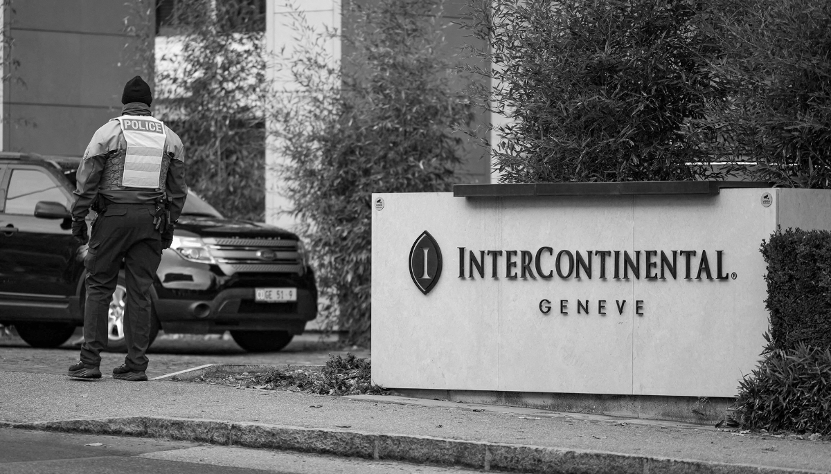 A diplomatic security officer secures the entrance of the InterContinental hotel as US and Ukrainian officials prepare for closed-door talks on ending Russia's war in Ukraine.