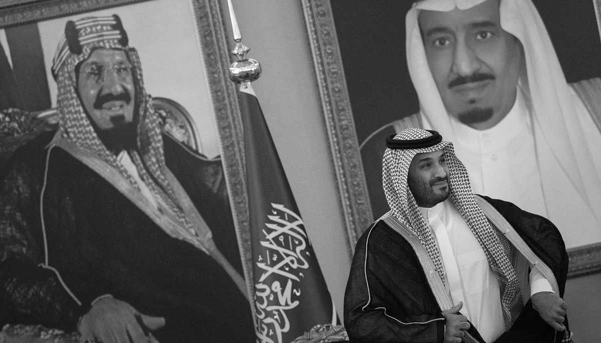 Saudi crown prince Mohammed bin Salman surrounded by portraits of his father King Salman and Abdulaziz bin Saud, the founder of modern Saudi Arabia.