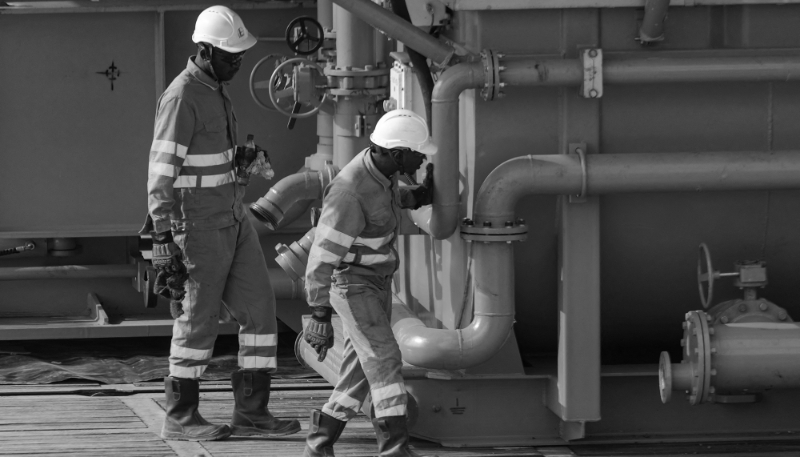 TotalEnergies employees work on the construction of a drilling platform in Murchison Falls National Park, western Uganda, 22 February 2023. 