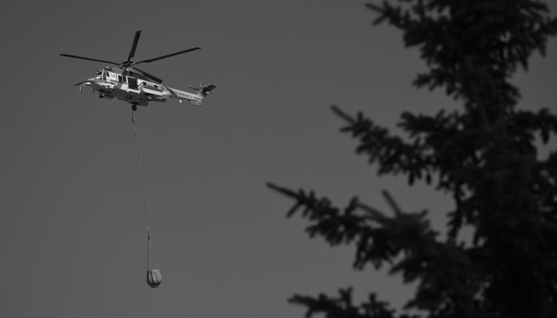 An Airbus H225 helicopter flies over Kyiv in 2025.
