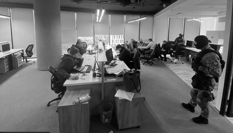 Ukrainian cyber police officers searching a call centre. Computers and telephones were seized.