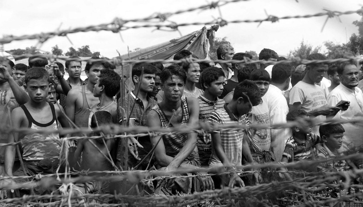 Rohingya refugees gather between the Bangladeshi and Burmese borders on 24 August 2018.
