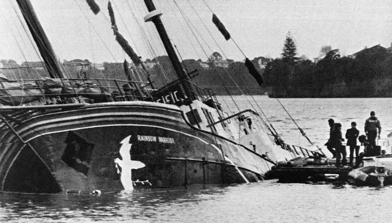 The Greenpeace flagship Rainbow Warrior lies on its side in Auckland harbour 10 July 1985, after being blown-up by French secret service agents during the night of 9 July. 