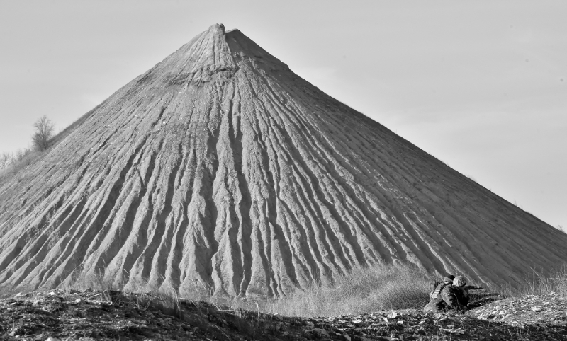 A soldier in front of a coal mine slag heap in the town of Kurakhove, Donetsk region.