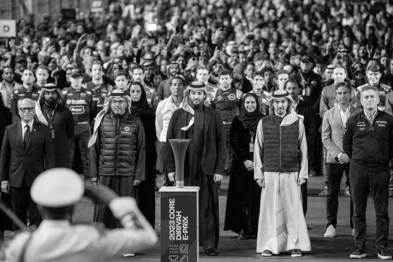 Mohammed Bin Salman (centre) and Jerry Inzerillo (left) at the Formula-E race at the Diriyah circuit in Riyadh on 28 January.
