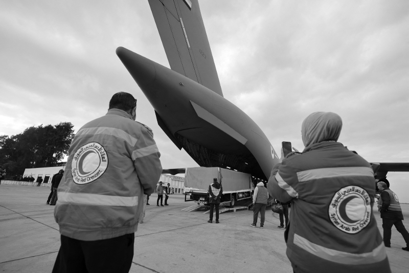 Syrian Red Crescent workers at Damascus International Airport on 9 February 2023.