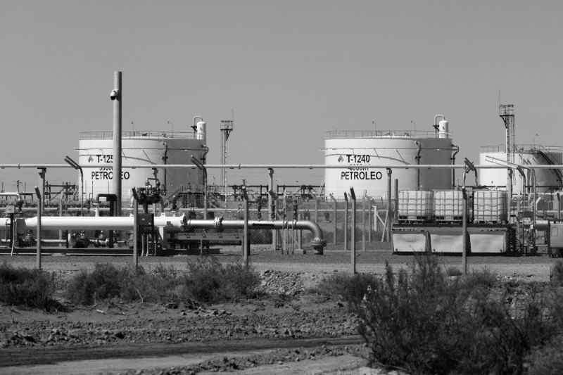 Oil pipelines and storage facilities are seen at Vaca Muerta shale oil and gas drilling, in the Patagonian province of Neuquen, Argentina, 15 February 2023.